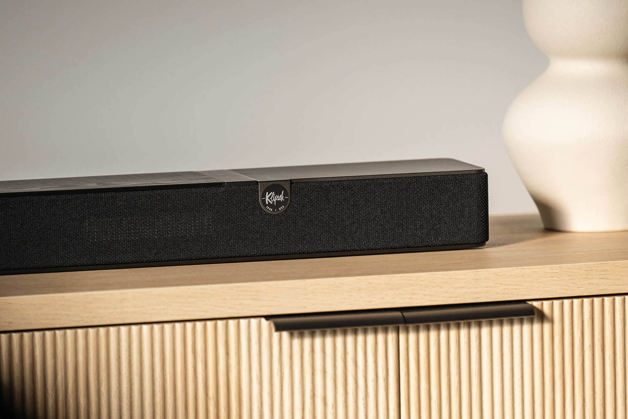 Klipsch Flexus Core 200 on Modern Media Console Beside Vase 2000x1333