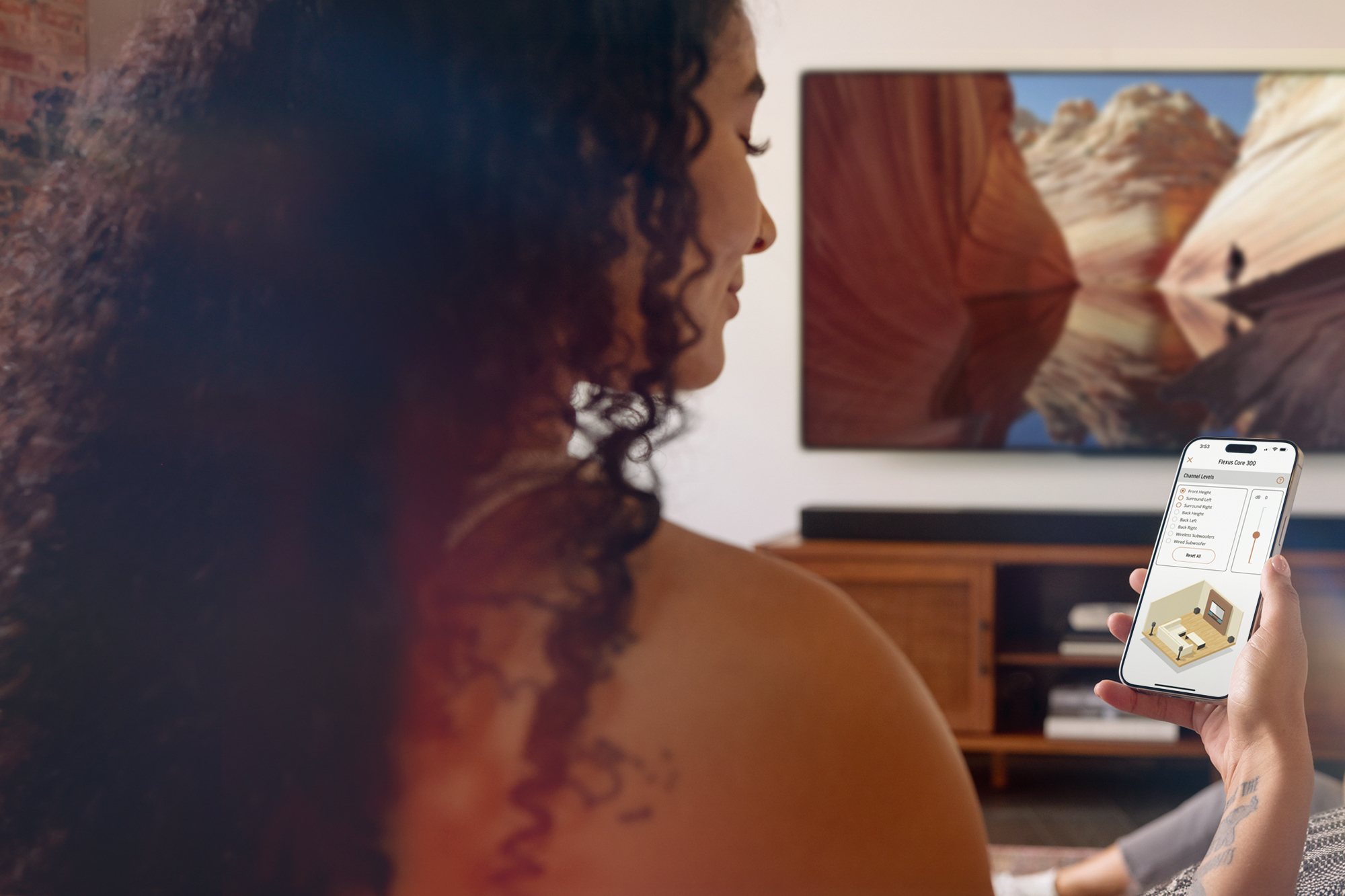 Klipsch Flexus woman using Klipsch Connect Plus app to control her Core 300 2000x1333 1