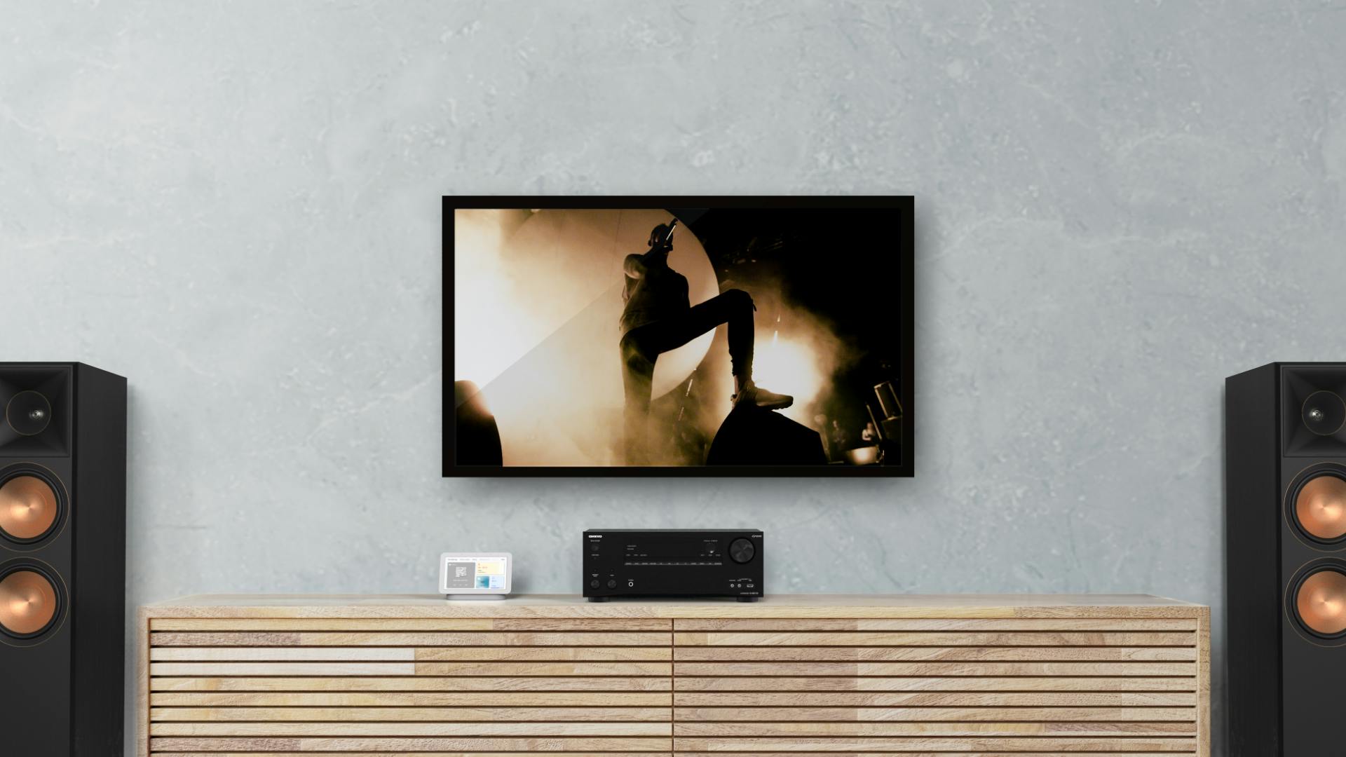 Onkyo 7100 RP8060 FA Beside TV Showing Concert