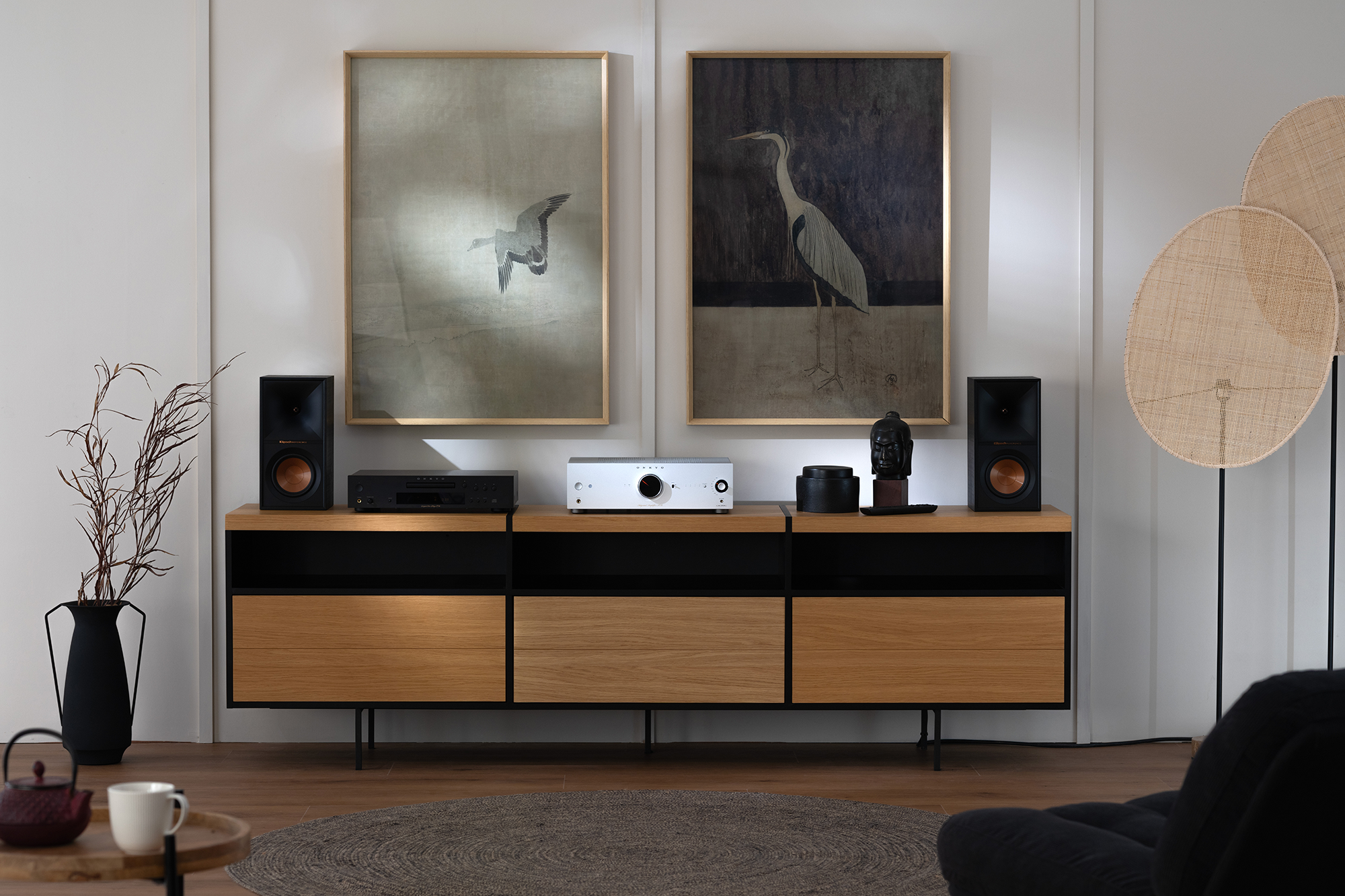 Onkyo Icon A 50 and C 30 Silver and Klipsch bookshelf speakers on media console with crane art on wall behind 2000x1333