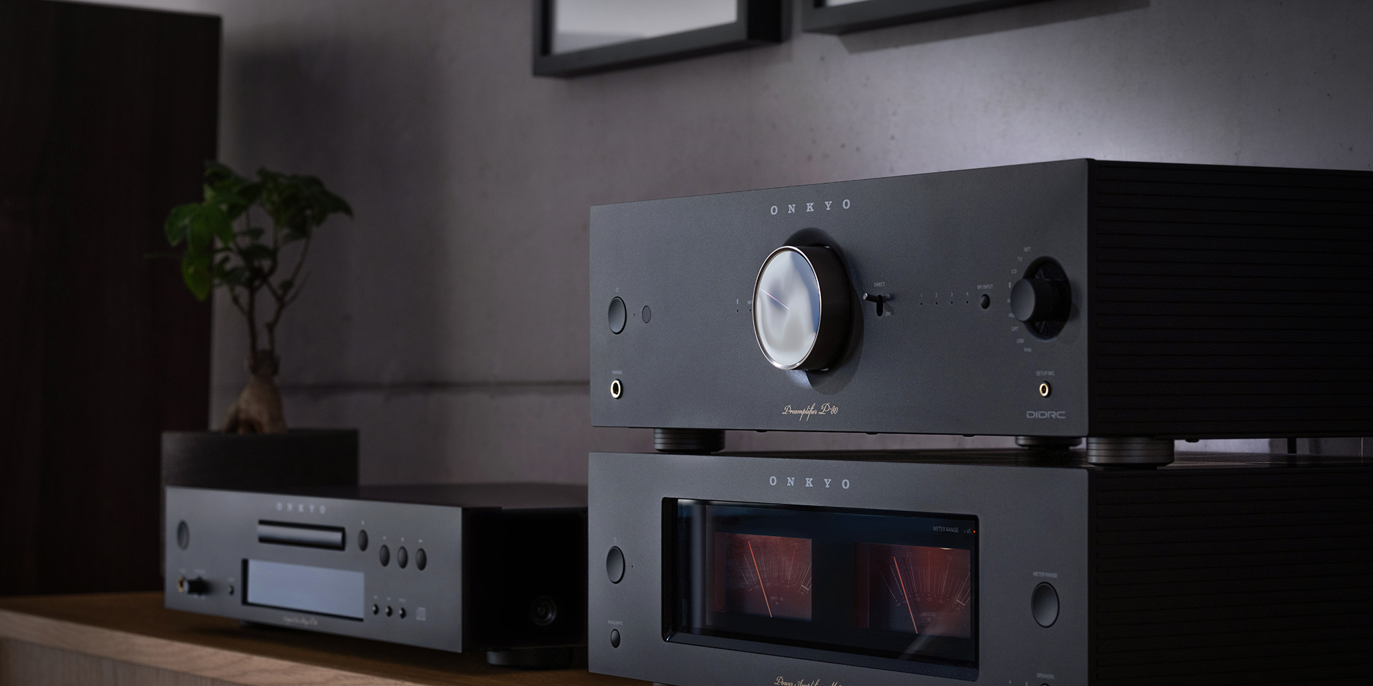 Onkyo Icon P 80 M 80 C 30 black at angle with bonsai behind and P 80 in foreground 2000x1000