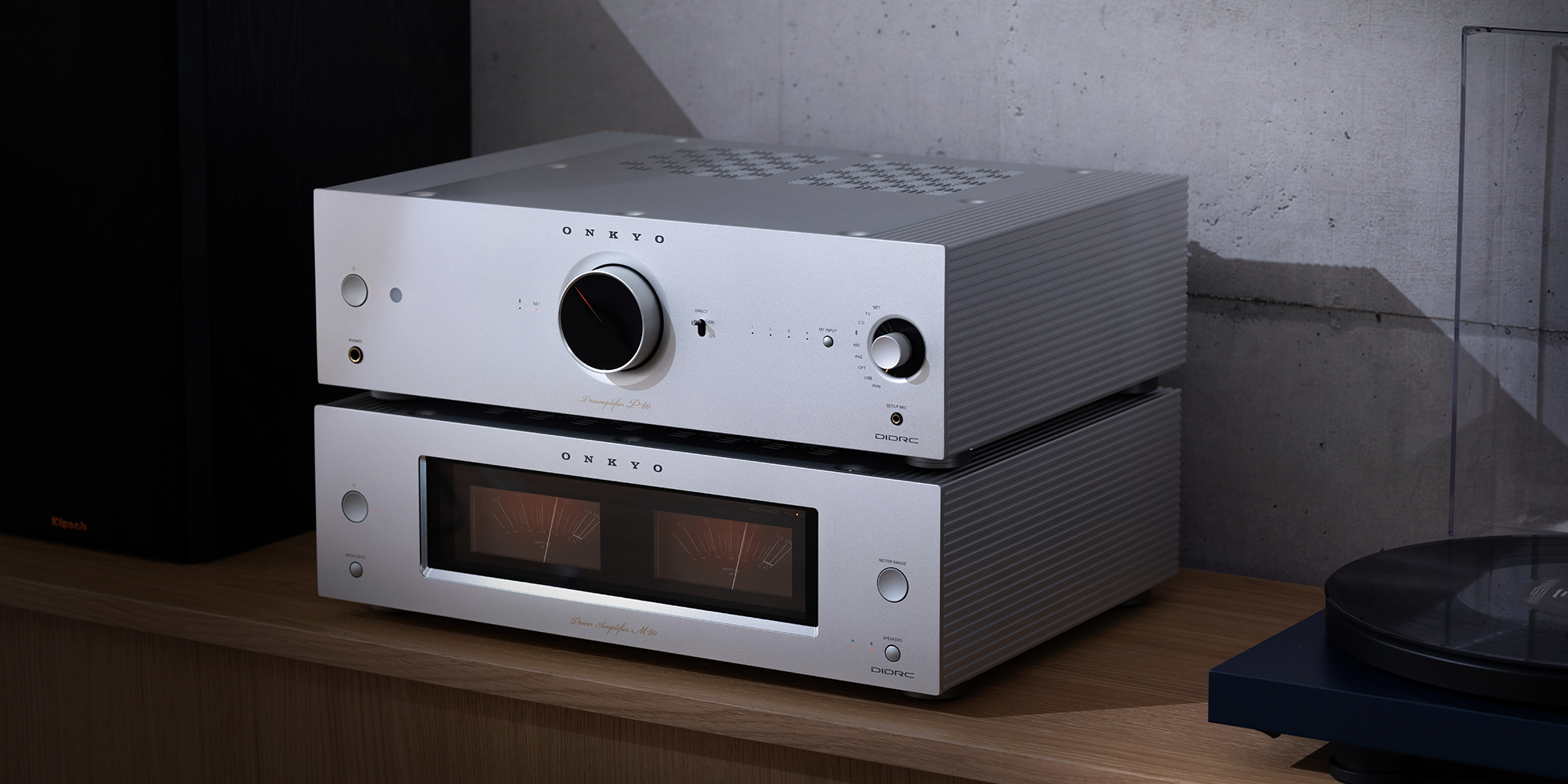 Onkyo Icon P 80 and M 80 silver stacked from angle beside turntable 2000x1000