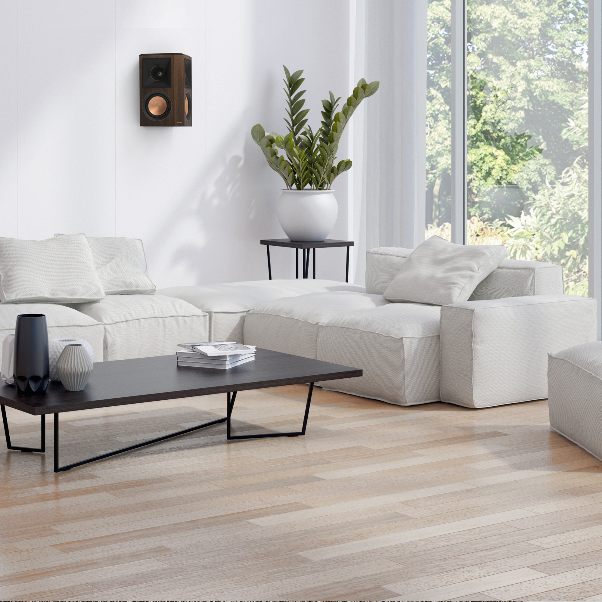 RP 502 S II surround speaker in walnut finish hung on a white wall near a living rooms corner mobile