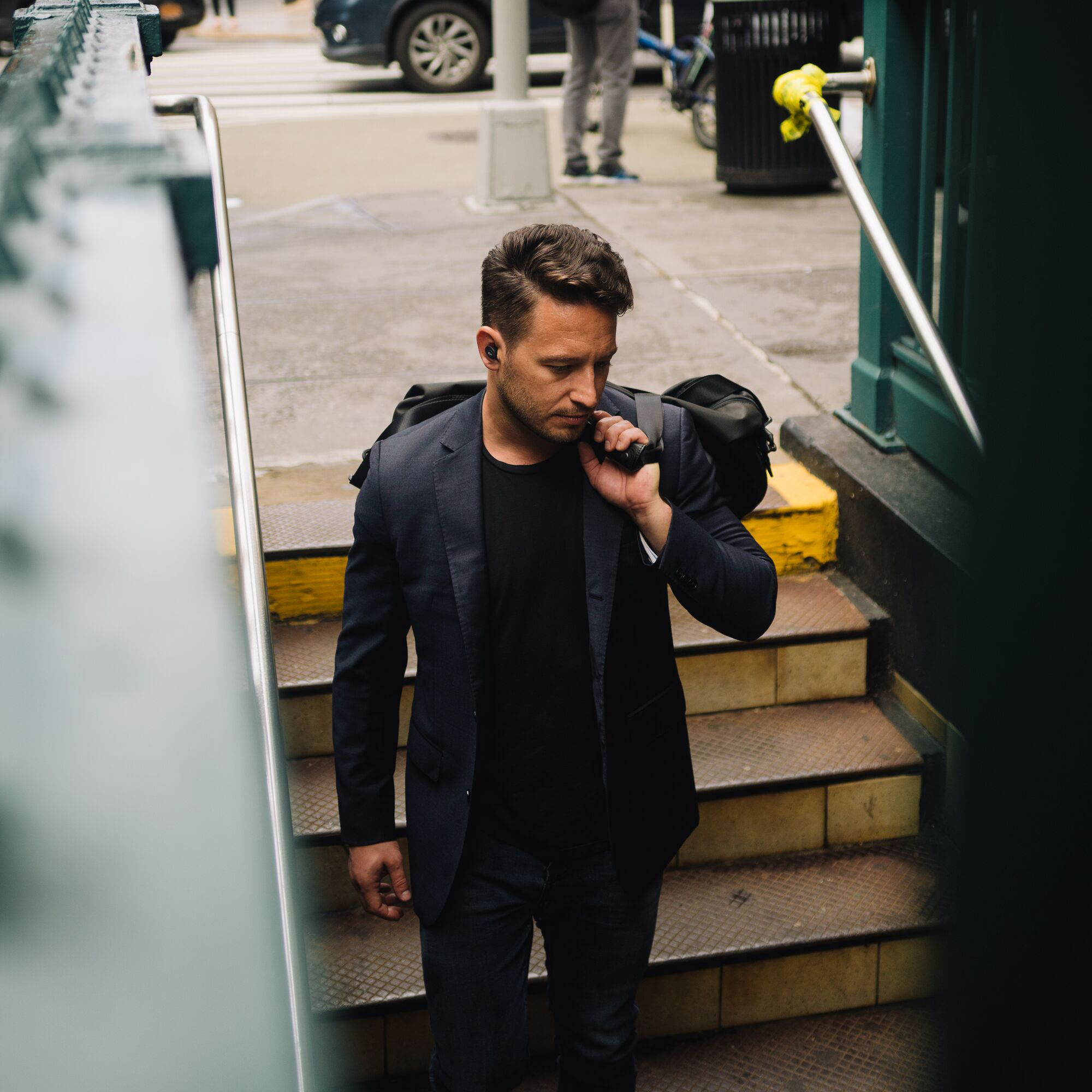 Klipsch T5 II ANC earphones man going to subway 1