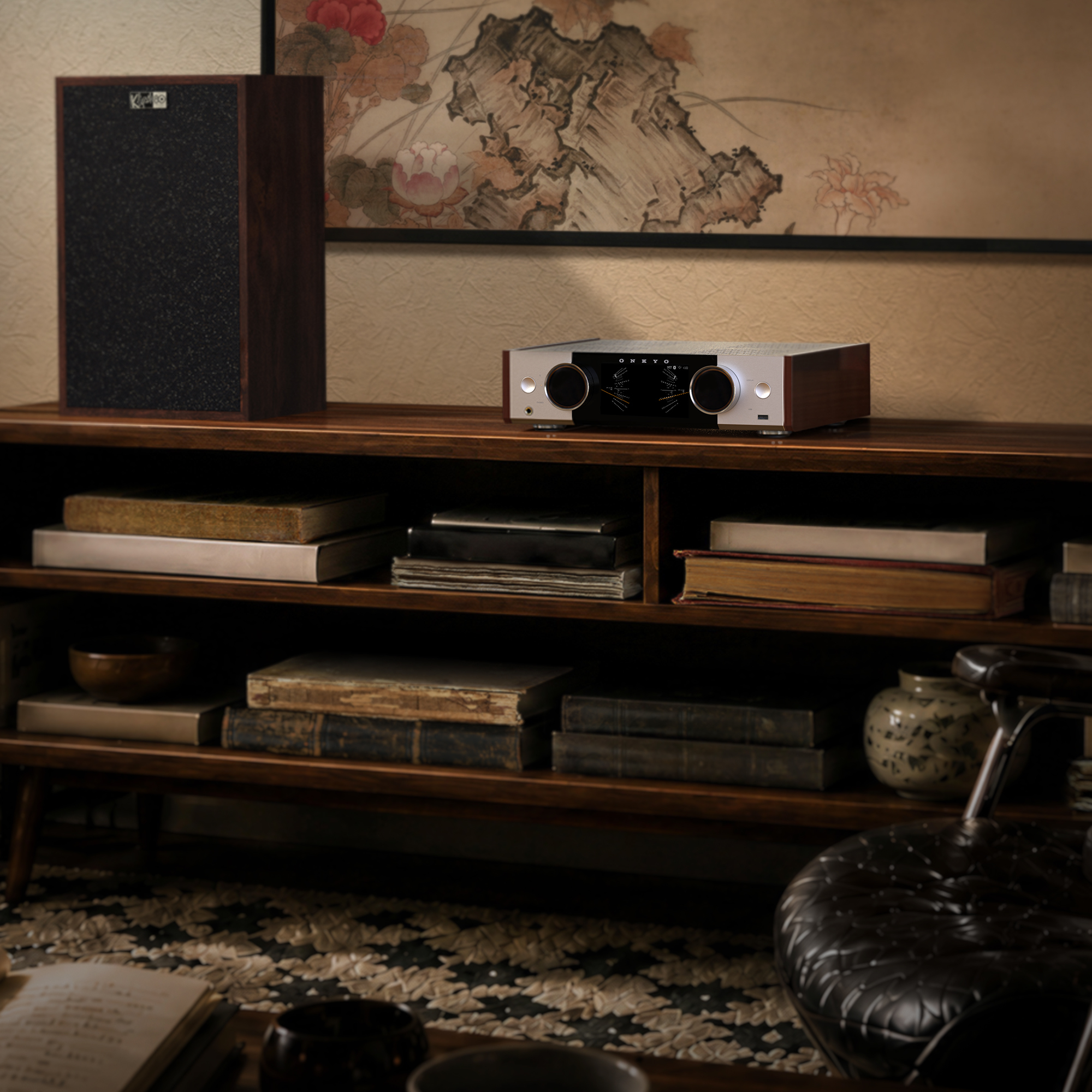 Onkyo Muse80th 00 on bookshelf in room with warm furnishings and premium bookshelf speakers 2000x2000